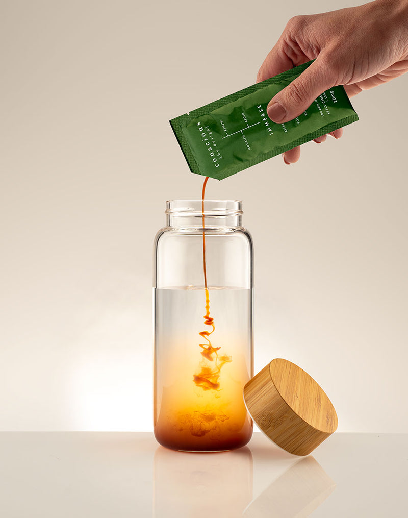 IMMERSE being poured into a glass showing the effects of this morning detox drink
